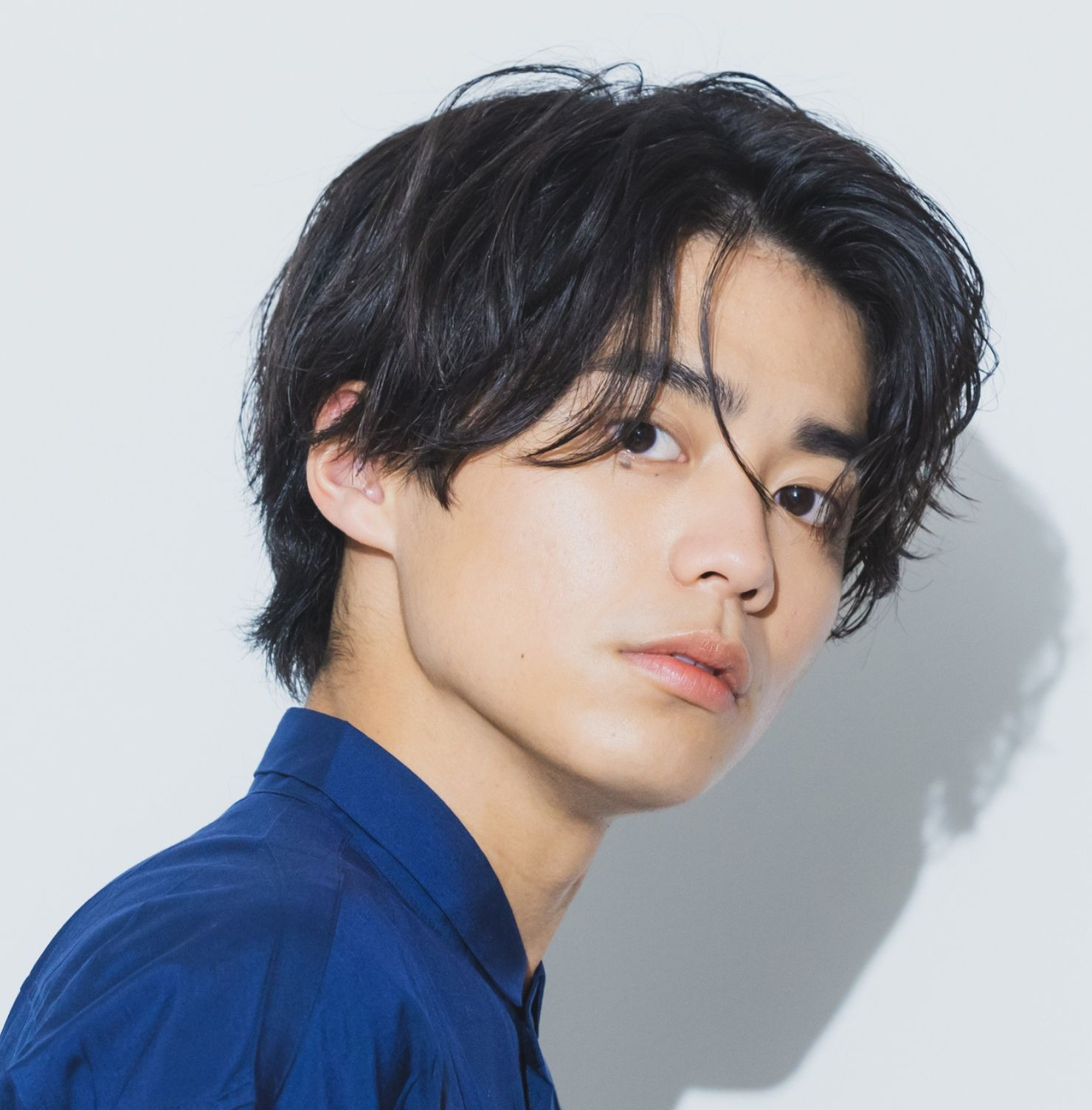 Kiểu tóc mullet nam ngắn với phần hai bên fade gọn và đuôi tóc vừa phải