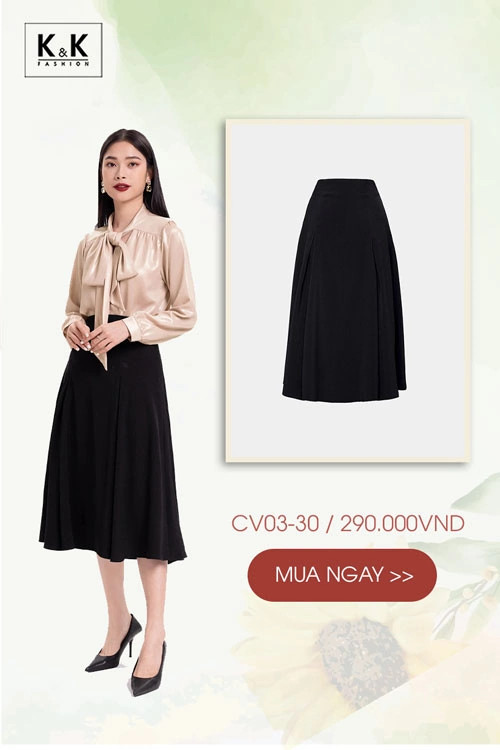 Cô gái diện chân váy midi đen xếp ly dài phối cùng áo sơ mi xanh pastel