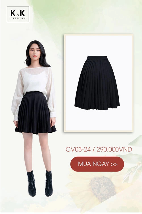 Cô gái diện chân váy đen xòe xếp ly ngắn phối cùng áo blouse trắng tay phồng
