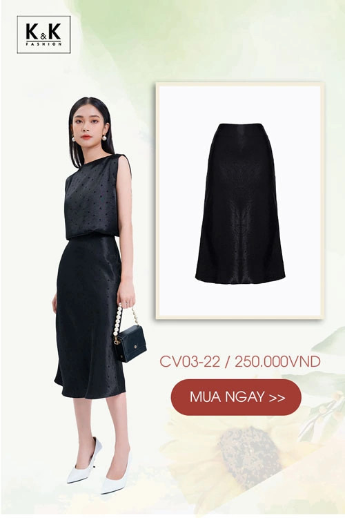 Cô gái diện chân váy đen dài họa tiết chấm bi phối cùng áo blouse trắng thanh lịch